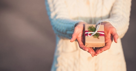 Person presents a gift