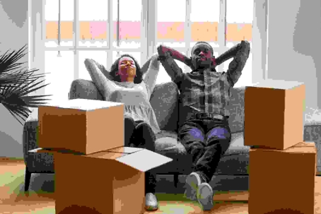 man and woman relaxing after packing for move