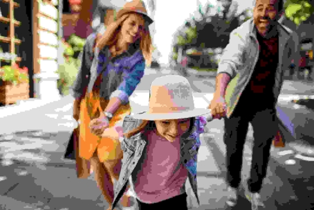 mom dad and daughter shopping in downtown