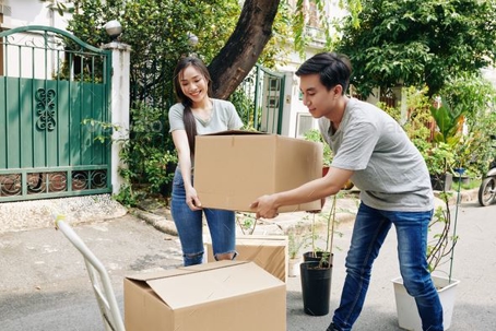 young couple moving boxes