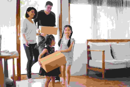 parents and two children moving into new home