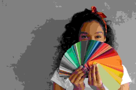 woman holding paint samples