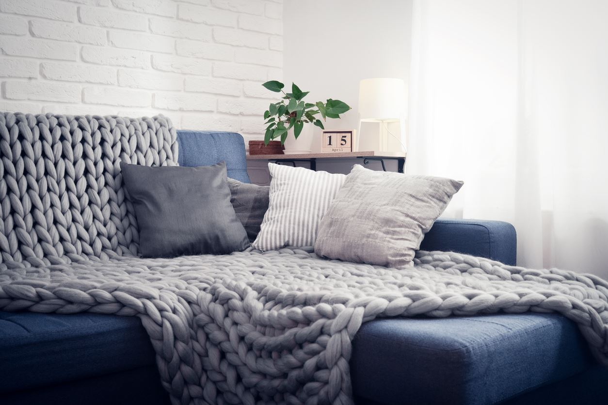 couch with chunky throw and pillows
