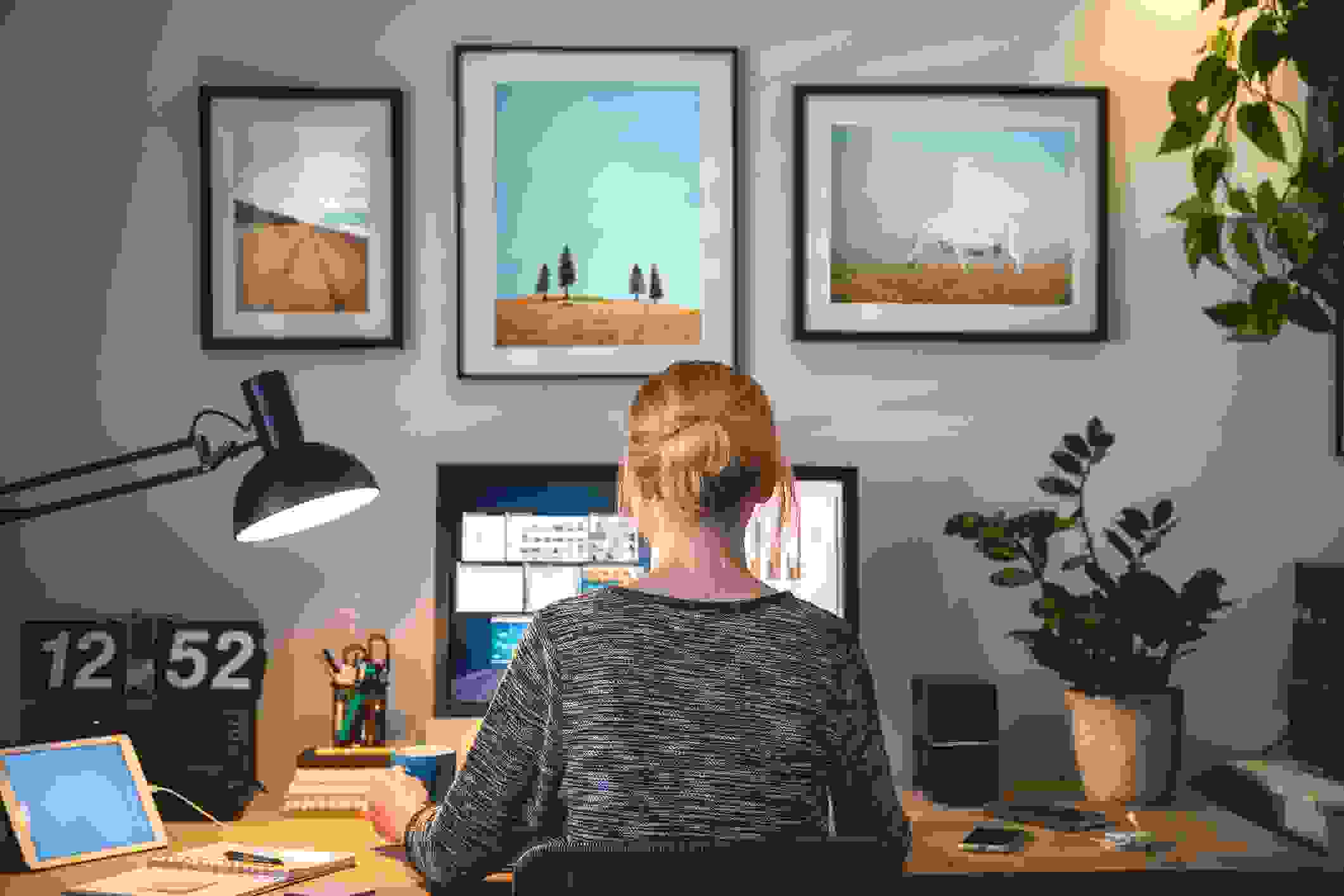 woman working from home at decorated desk